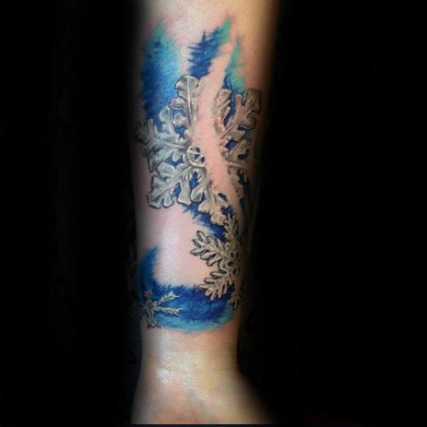 Broken snowflake tattoo on forearm