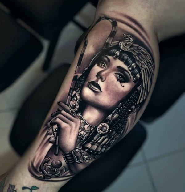 Cleopatra holding scepter calf tattoo