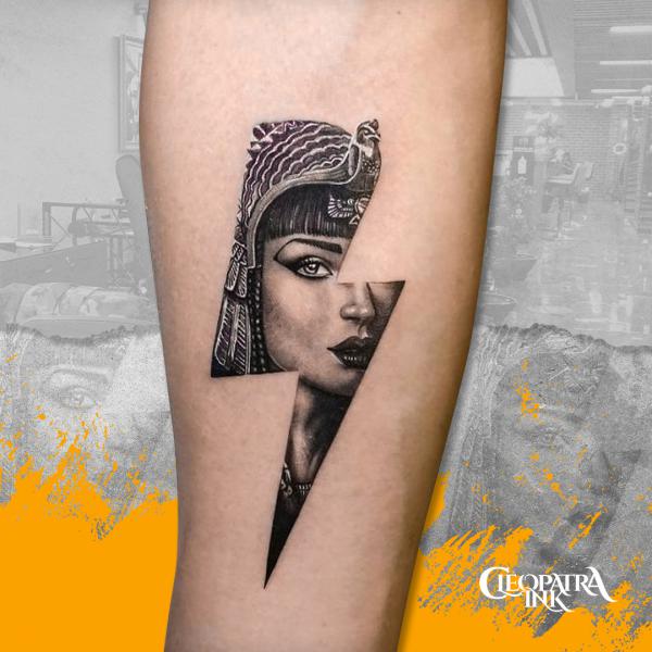 Cleopatra lightning bolt tattoo