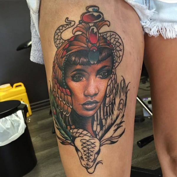 Cleopatra portrait and snake thigh tattoo