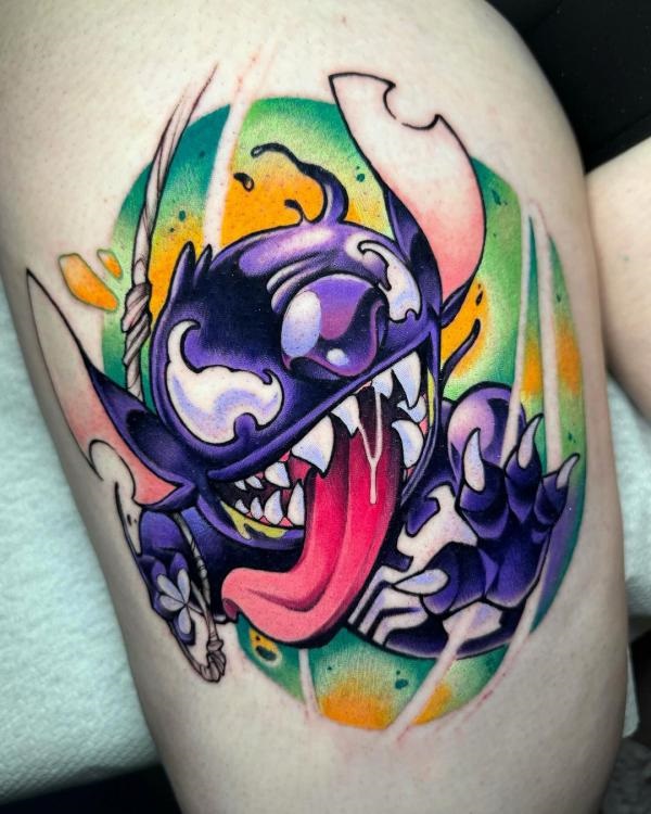 Colorful venom thigh tattoo