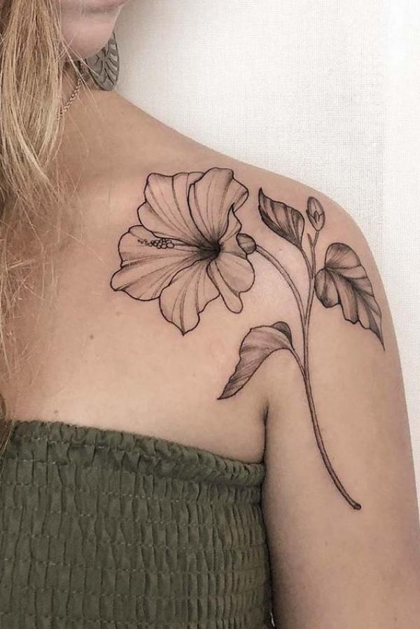 Dainty hibiscus shoulder tattoo