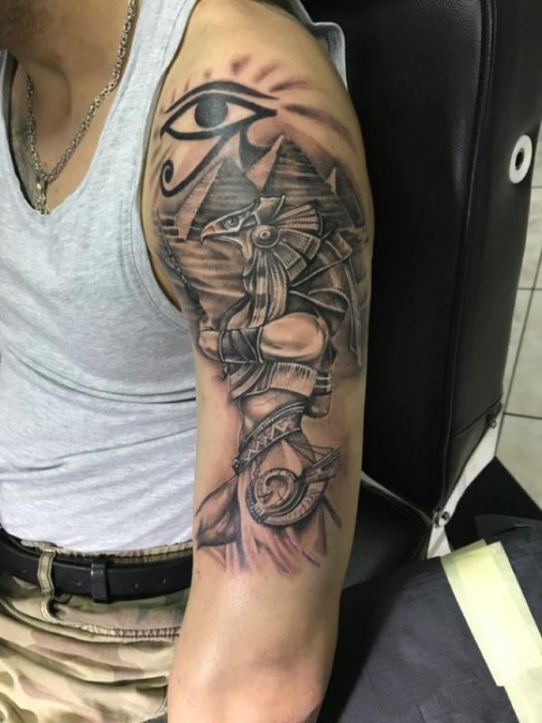 Falcon warrior Horus Pyramids and Eye of Ra tattoo