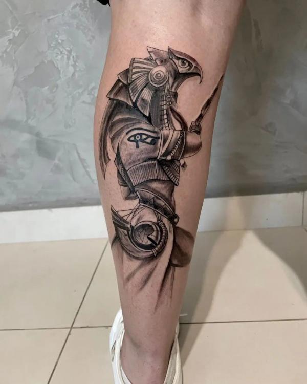 Falcon warrior Horus calf tattoo