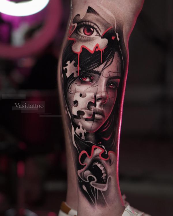 Female fave and eye with puzzles tattoo