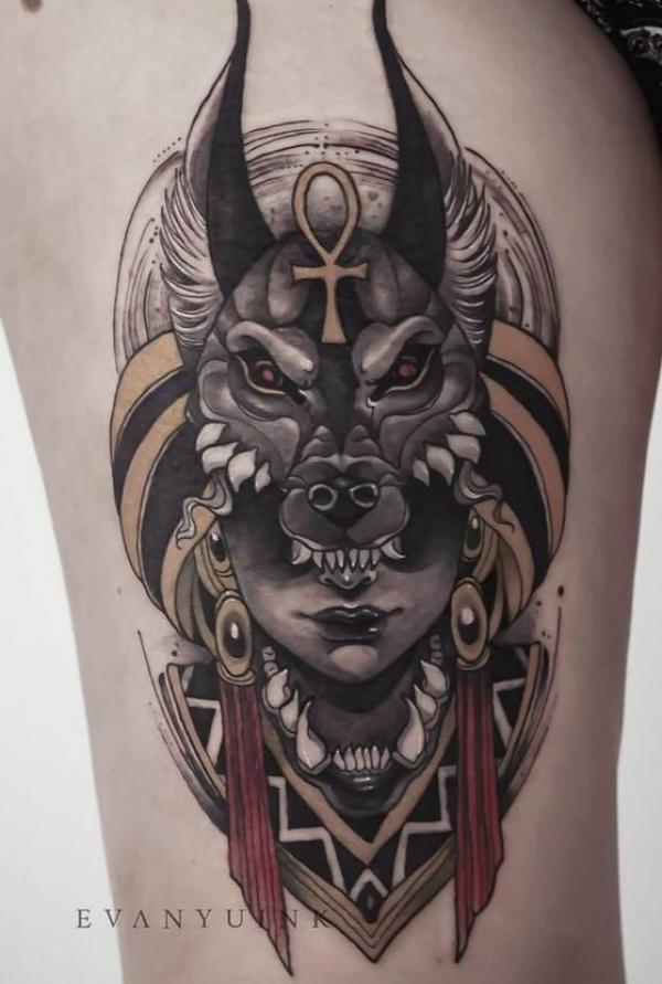 Female with Anubis headdress thigh tattoo