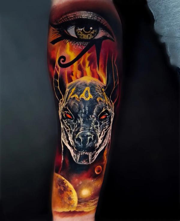 Firing Anubis and eye of Ra tattoo