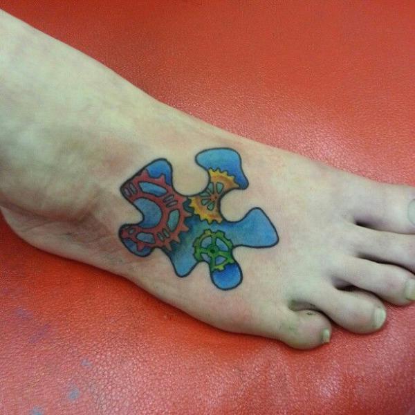 Gear puzzle foot tattoo
