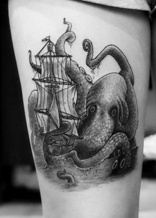 Giant kraken ship drawing tattoo on thigh