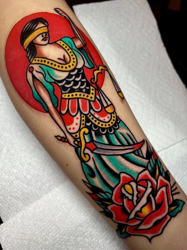 Goddess Themis with knife and scales of justice tattoo old school
