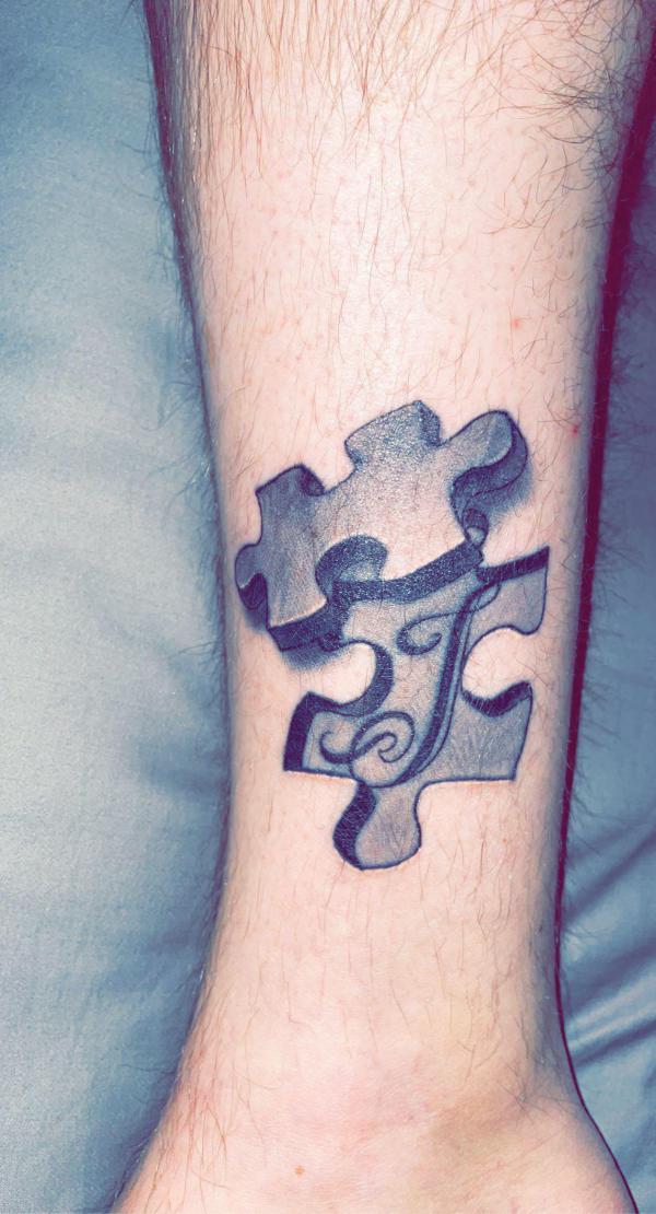 Grey 3D missing puzzle tattoo