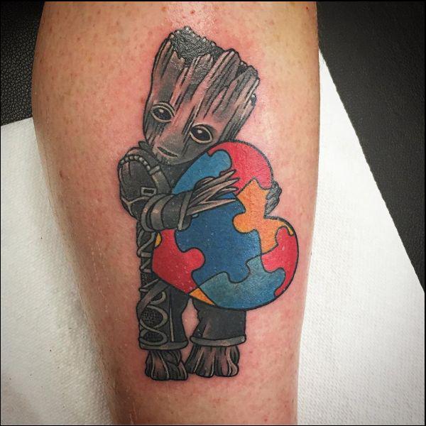 Groot jigsaw holding puzzle heart tattoo