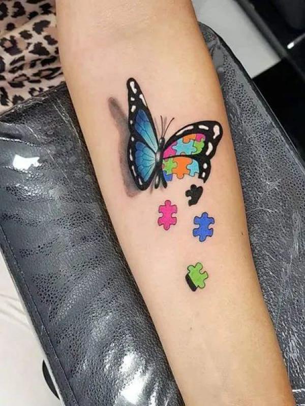Half puzzles half blue butterfly tattoo