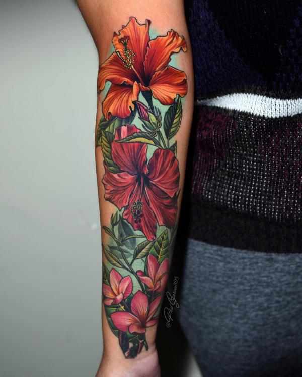 Hibiscus and plumeria outer forearm tattoo