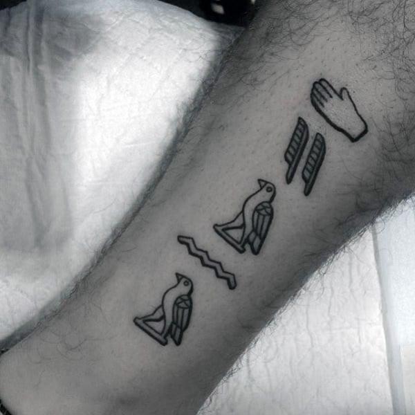 Hieroglyphics outline tattoo