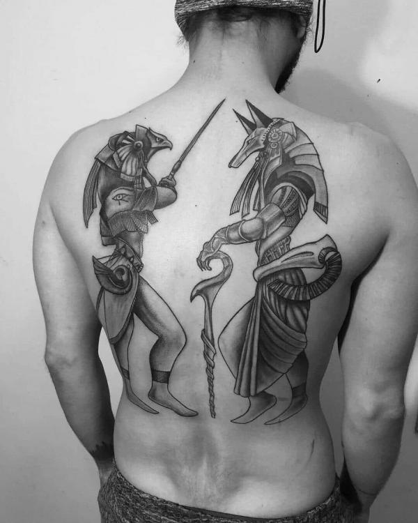 Horus and Anubis drawing tattoo on back