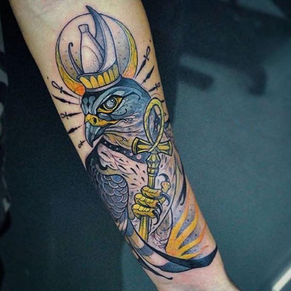 Horus holding Ankh tattoo on forearm