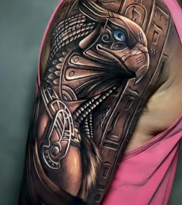 Horus with Hieroglyphics half sleeve tattoo