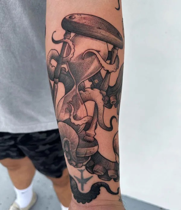Hourglass with Kraken tentacles tattoo
