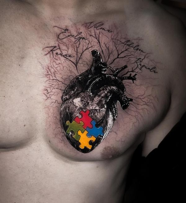 Human heart with autismo chest tattoo