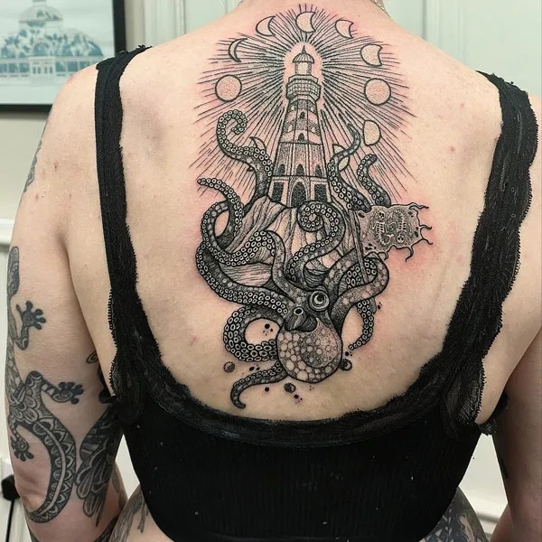 Kraken and lighthouse with moon phase tattoo on back