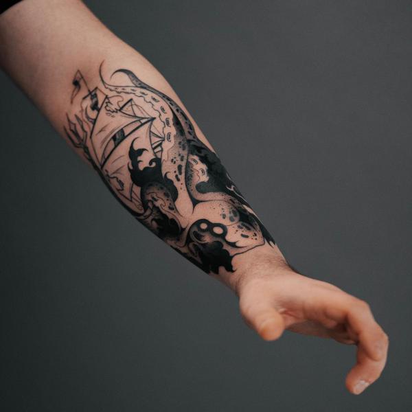 Kraken shipwreck forearm tattoo