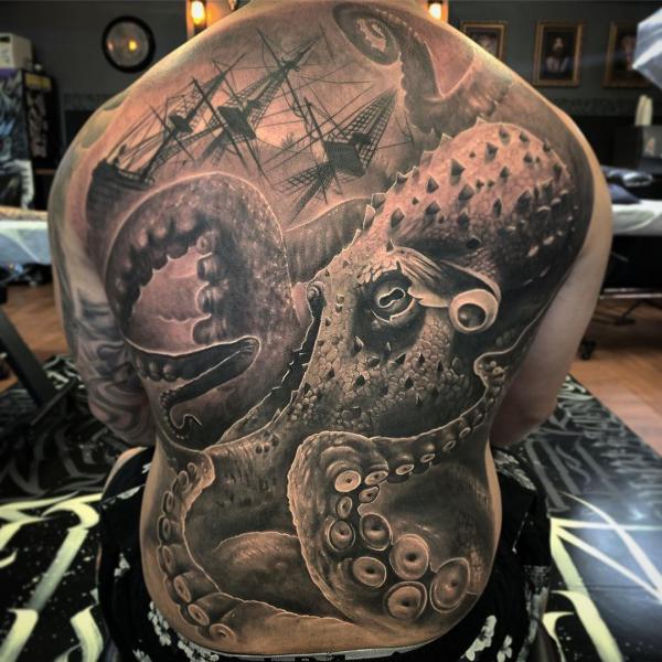 Large octopus with shipwreck back tattoo