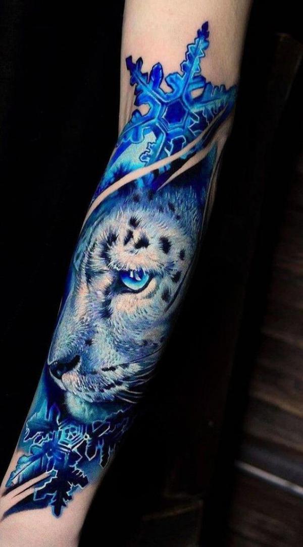 Leopard with snowflake sleeve tattoo