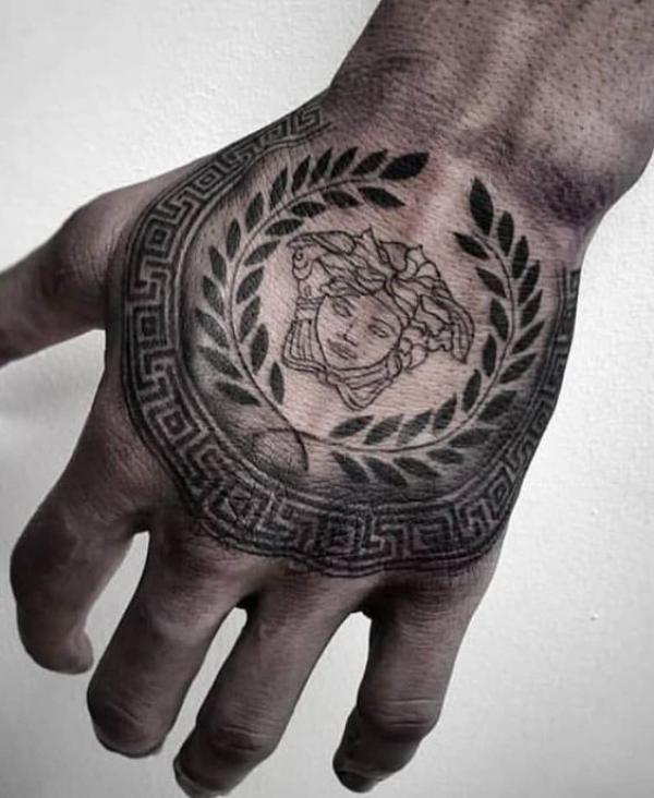 Medusa Gorgon with Greek Key and fern hand tattoo
