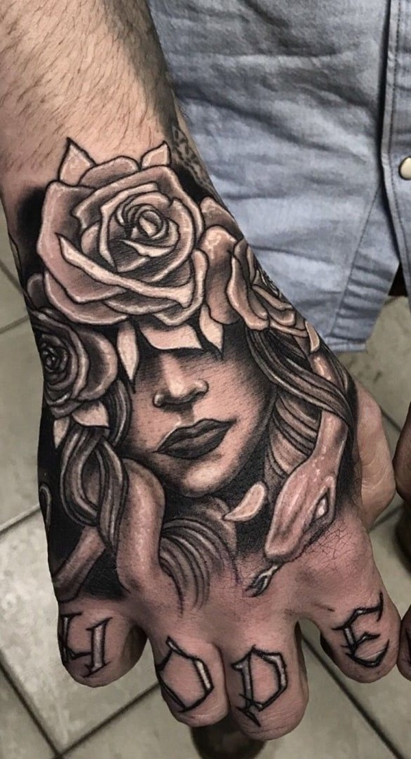 Medusa and rose hand tattoo