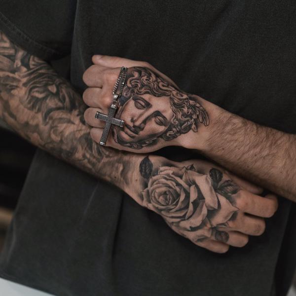 Medusa and rose matching hand tattoos