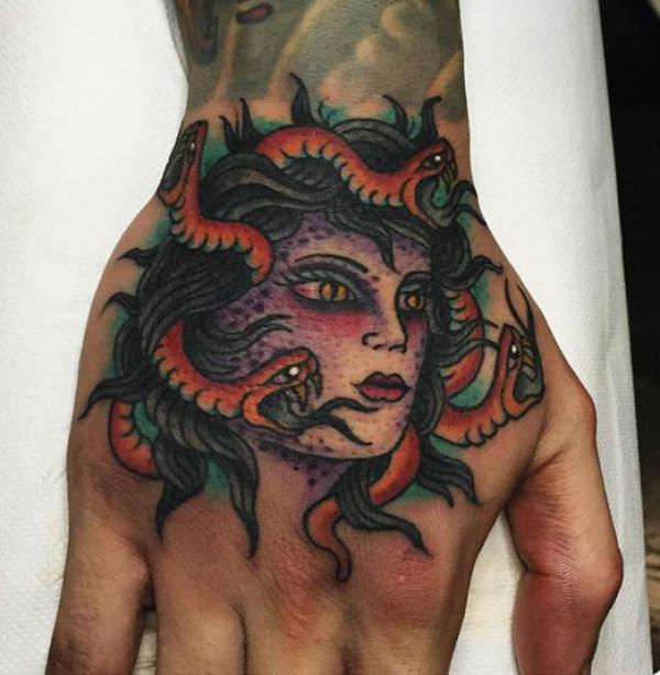 Medusa hand hand tattoo traditional