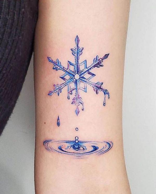 Melting snowflake and water drops tattoo
