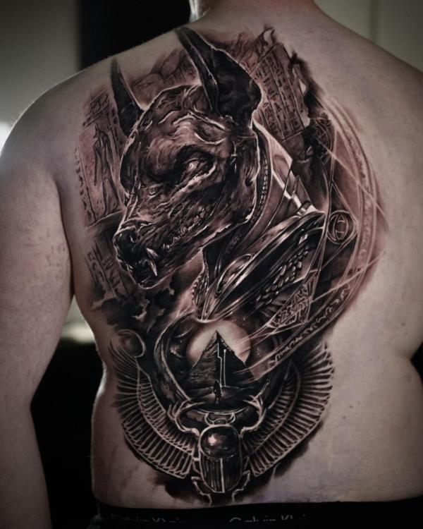 Metallic Anubis and Scarab Beetle tattoo on one side of back