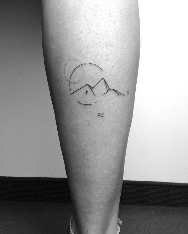 Minimalist pyramids tattoo