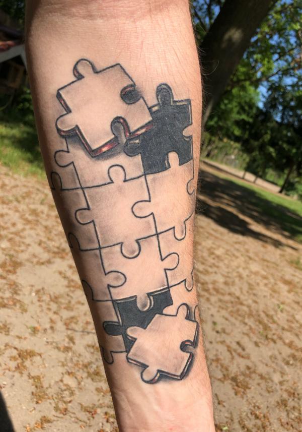 Missing two hearts forearm tattoo