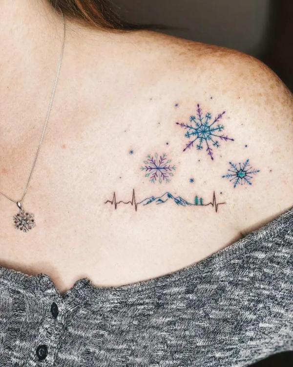 Mountain heartbeat with snowflake and stars tattoo