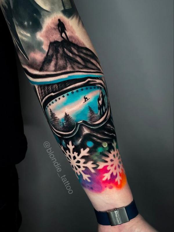 Mountain sunglass and snowflake tattoo