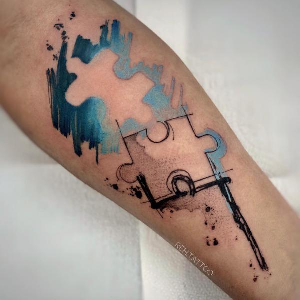 Negative space puzzle tattoo