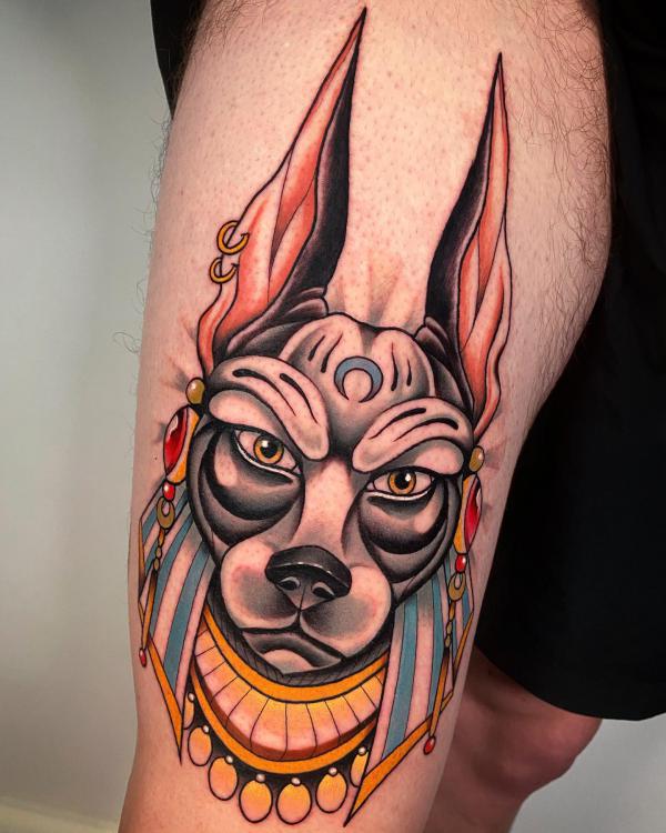 Neo traditional Anubis head thigh tattoo