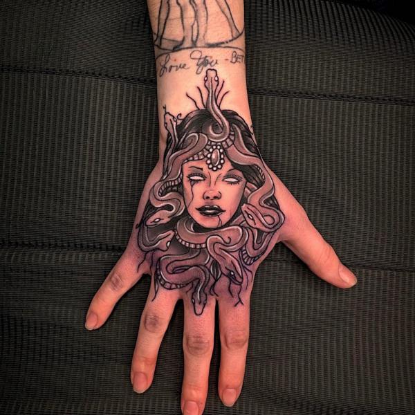Neo traditional Medusa hand tattoo