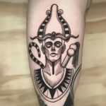 Osiris portrait tattoo on bicep