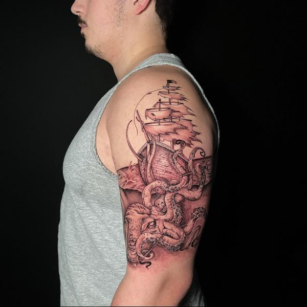 Pirate ship and kraken half sleeve tattoo