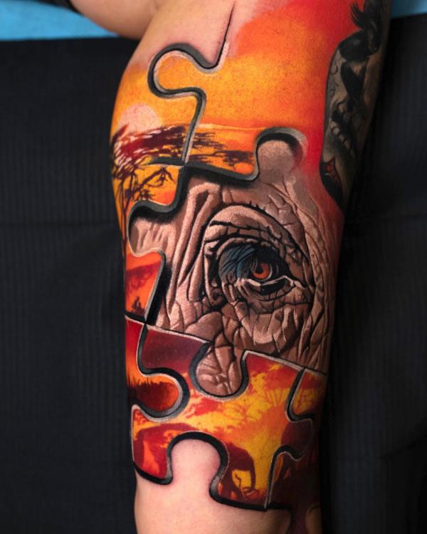 Puzzle animal eye tattoo