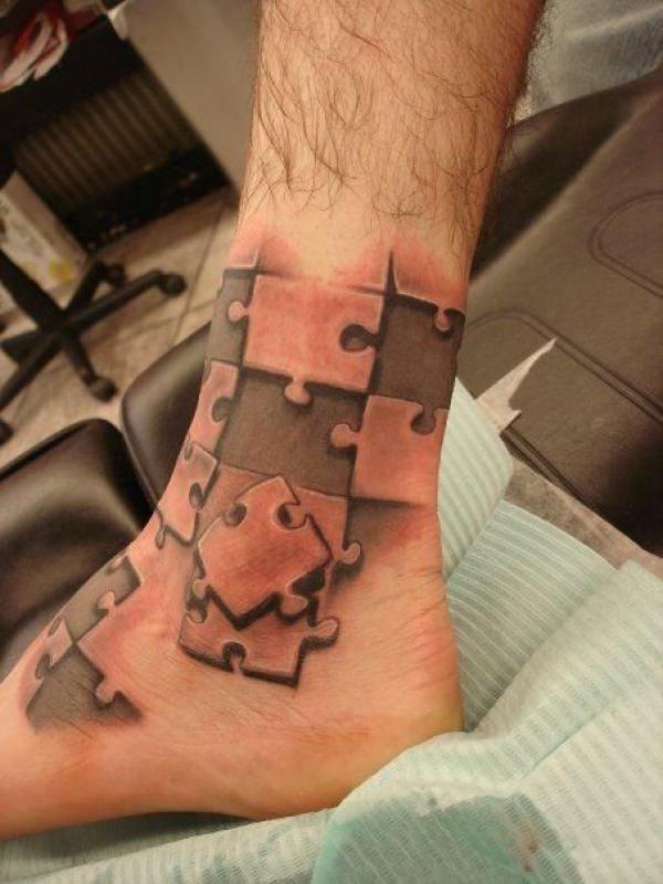 Puzzle ankle tattoo