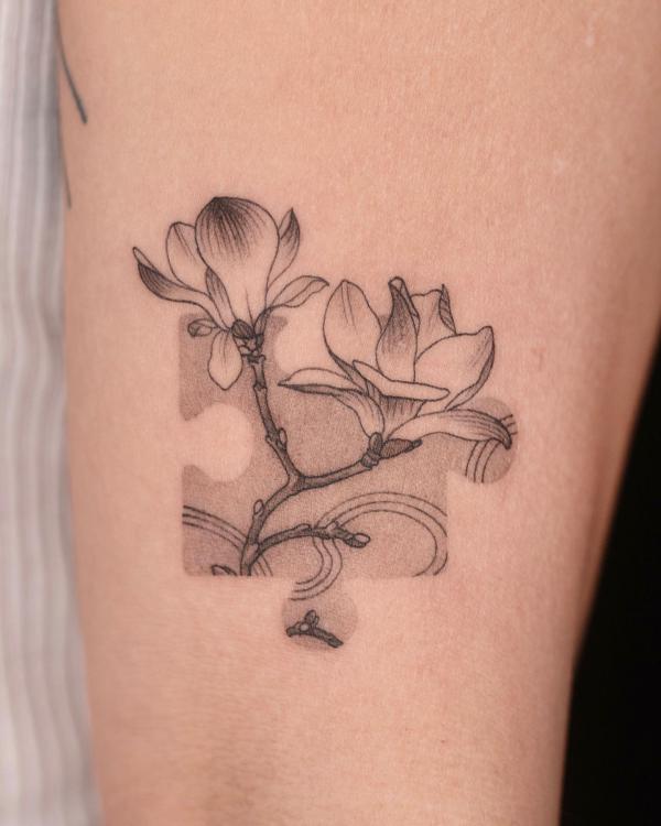 Puzzle flower tattoo
