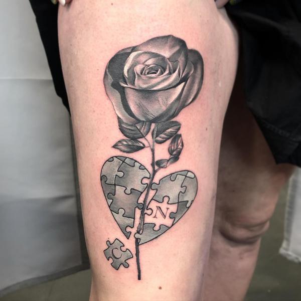 Puzzle heart and grey rose tattoo