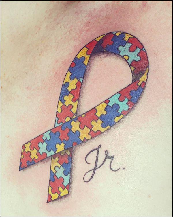 Puzzle ribbon tattoo