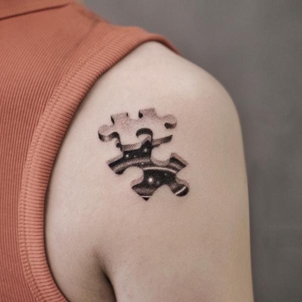 Puzzle shoulder tattoo