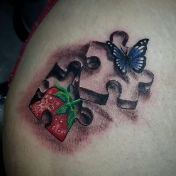 Puzzle with butterfly and Strawberry tattoo